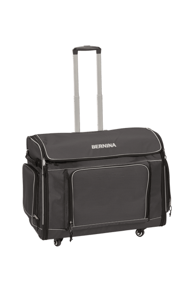 Valise à roulettes grise BERNINA XL avec poignée télescopique déployée, pour les machines des séries 7 et 8.
