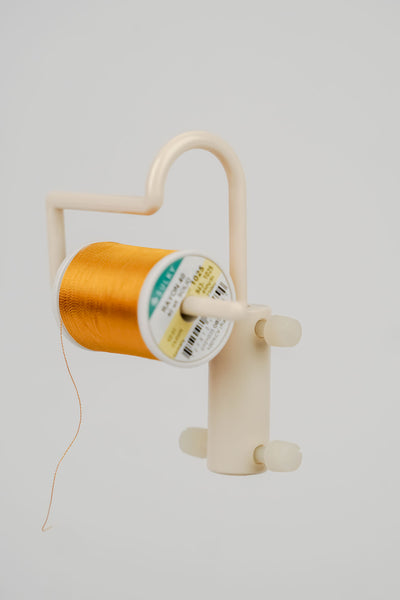 Reduziere das Reißen von Metallicgarn und Effektgarn