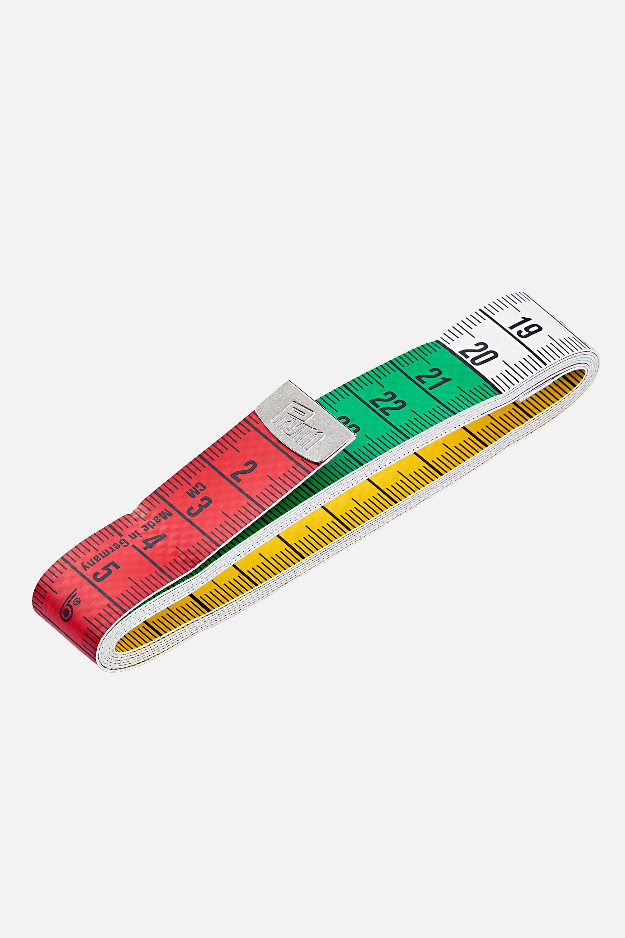 Prym Maßband „Color“ zusammengelegt, farbig segmentierte cm-Skala (rot/grün/weiß) und gelbe Rückseite sichtbar, Metallklemme mit Prym-Logo.