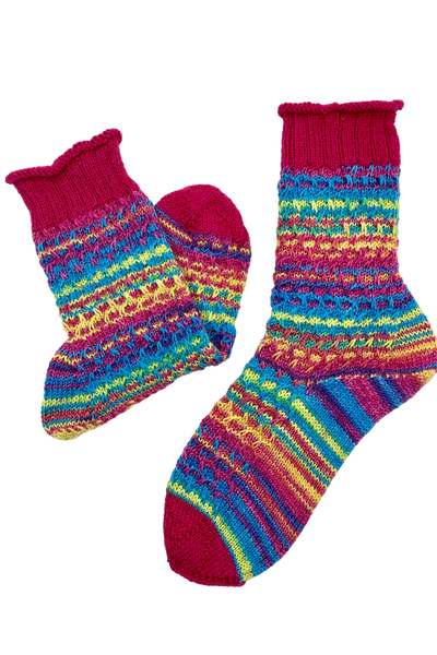 Colourful 15-Years-Socks in gradient yarn with rolled edge and slip-stitch pattern