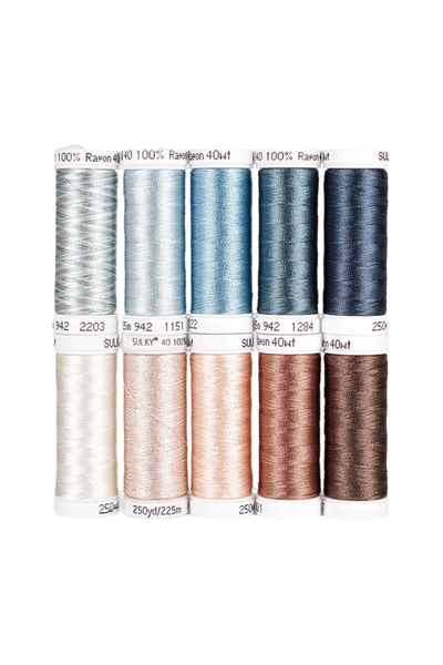 Dix bobines à clipser SULKY Rayon 40 de la collection SKY & SAND, dans des tons de bleu, crème et marron