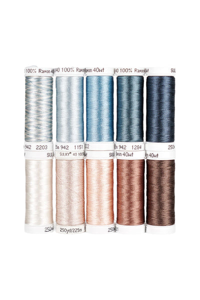Ten SULKY Rayon 40 snap spools from the SKY & SAND set in shades of blue, cream, and brown