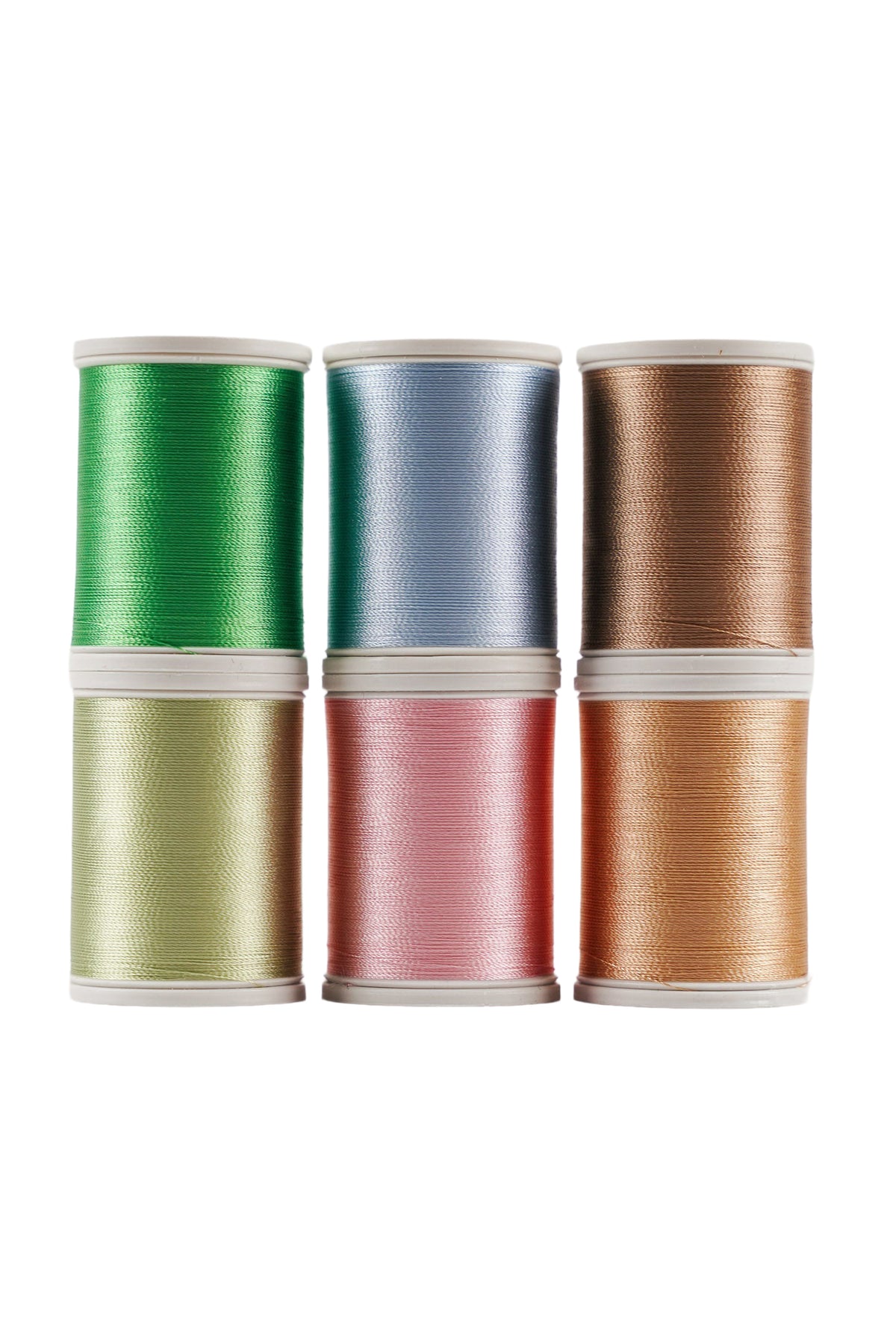Six SULKY Rayon 40 spools of yarn from the SPRING set in green, pink, and warm natural tones